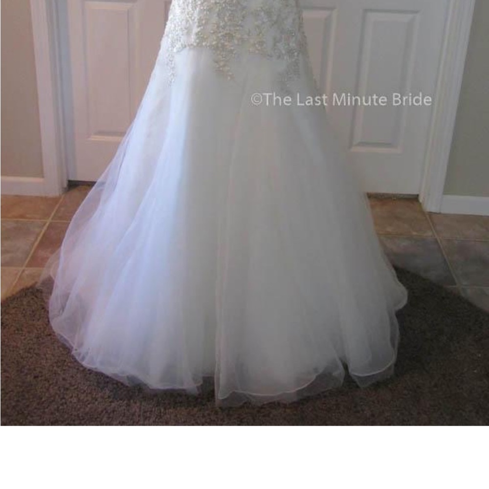 Maggie Sottero Ivory Ball Gown with Silver Beaded Bodice - Picture 5 of 11